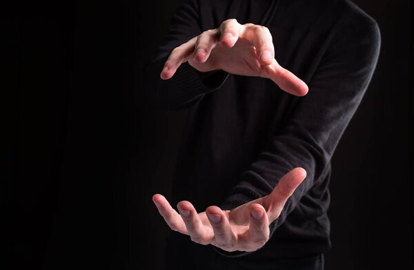 Man holding his hands and showing something