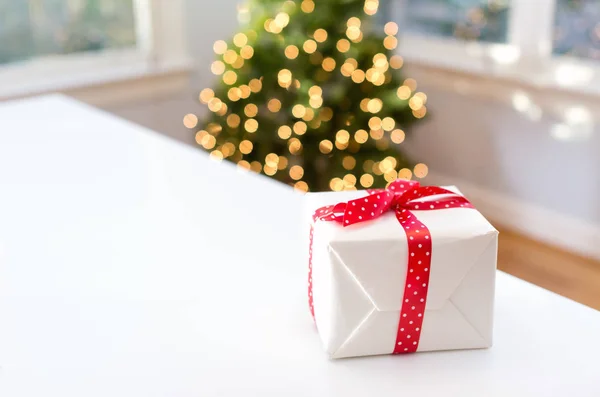 Christmas gift box on a table — Stock Photo, Image