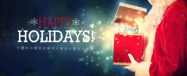 Mutlu tatiller mesaj Noel Baba hediye kutusu açma — Stok fotoğraf