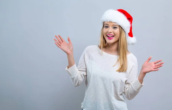 Mujer feliz con un sombrero de Santa — Foto de Stock