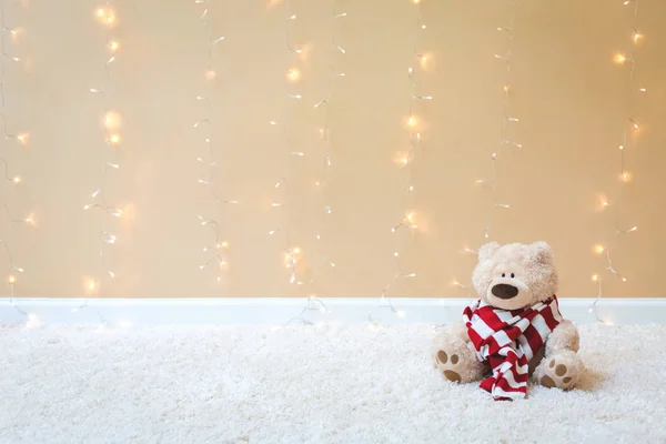 Teddy bear with red striped scarf — Stock Photo, Image
