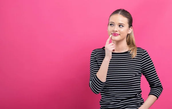 Young woman in a thoughtful pose — Stock Photo, Image