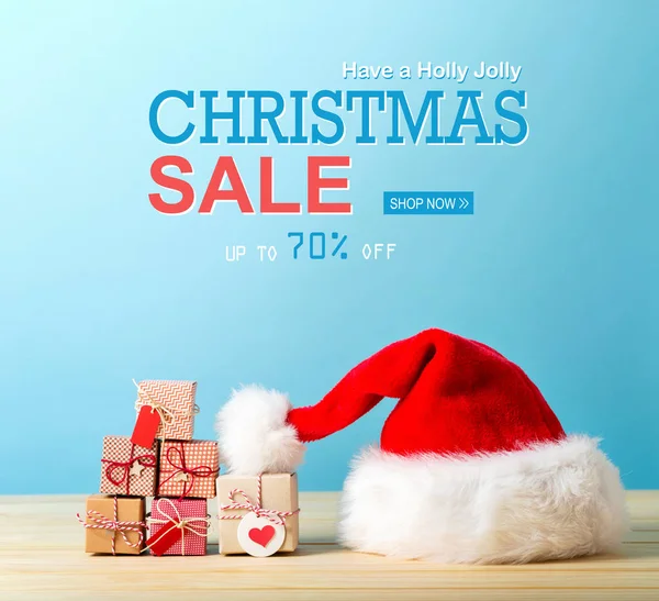 Försäljning Julhälsning Med Tomtemössa Och Tiny Christmas Presentaskar — Stockfoto