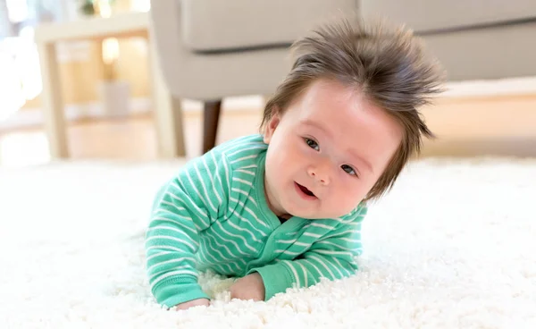 Happy baby boy lying down — Stock Photo, Image