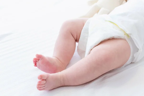 The feet of a young baby boy — Stock Photo, Image