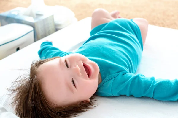 Happy baby boy lying down — Stock Photo, Image