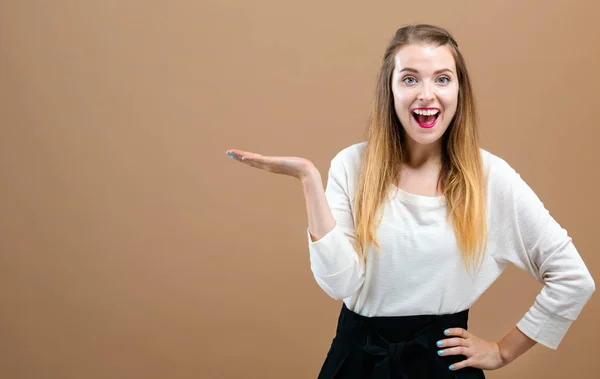 Young woman with displaying hand gesture — Stock Photo, Image