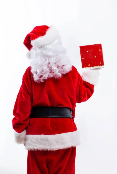 Santa gospodarstwa prezent na Boże Narodzenie — Zdjęcie stockowe