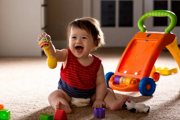 Happy boy playing with his toys — Stock Photo, Image