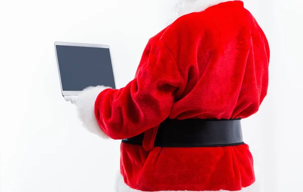 Santa utilizzando un computer portatile — Foto Stock