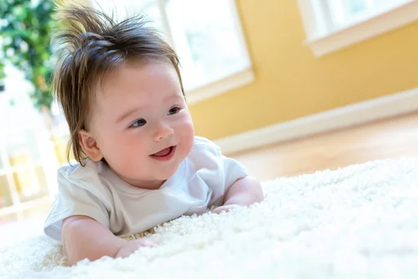 Happy baby boy lying down — Stock Photo, Image