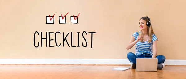 Checklist with woman using a laptop computer — Stock Photo, Image