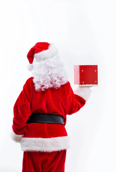 Santa κρατώντας ένα δώρο Χριστουγέννων — Φωτογραφία Αρχείου