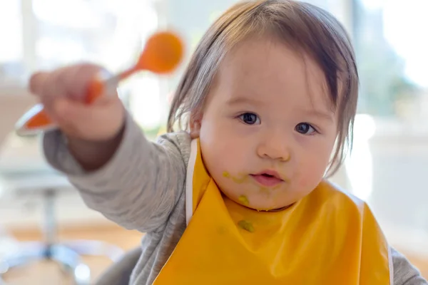 Toddler boy eating a meal — Stock Photo, Image