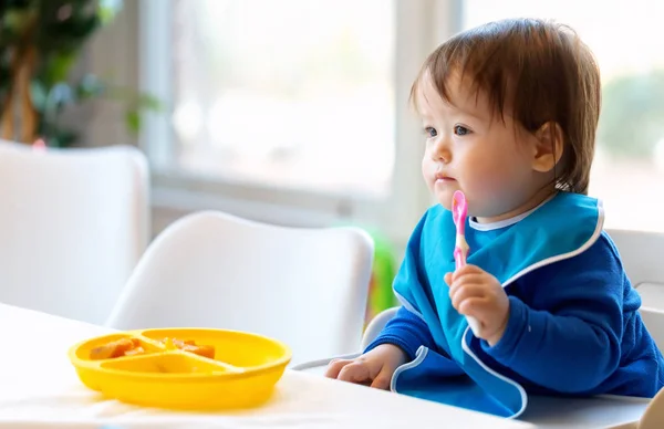 Toddler boy eating — Stock Photo, Image