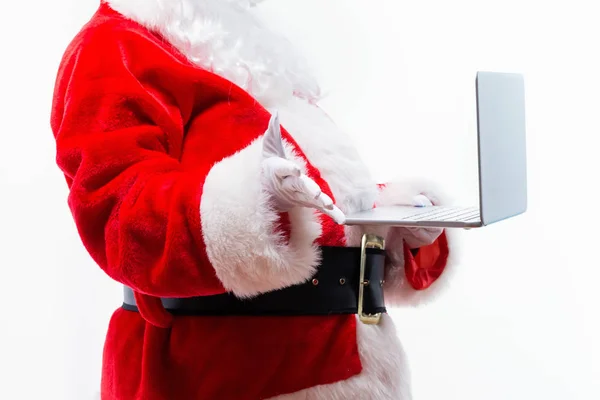 Santa utilizzando un computer portatile — Foto Stock