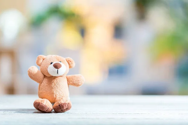 Cute plush stuffed teddy bear on a bright background — Stock Photo, Image