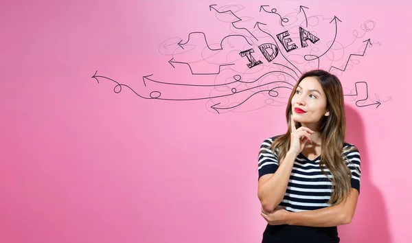Brainstorming idea arrows with young businesswoman — Stock Photo, Image