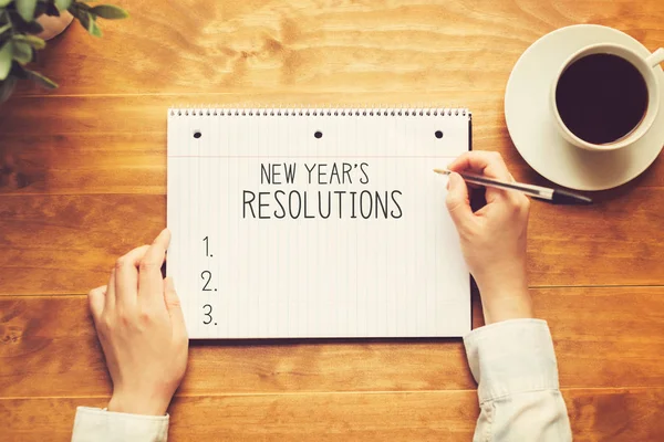 New years resolution with a person holding a pen — Stock Photo, Image