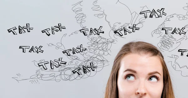 Tax problem theme with young woman — Stock Photo, Image