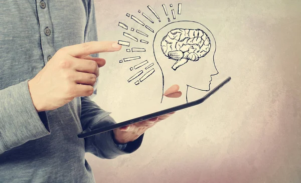 Ilustrace mozku s mužem drží tablet — Stock fotografie
