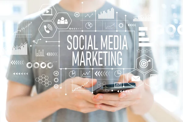 Social media marketing with man using a smartphone — Stock Photo, Image