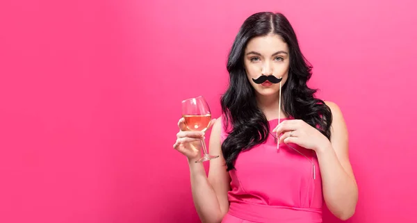 Woman with champagne and party stick — Stock Photo, Image