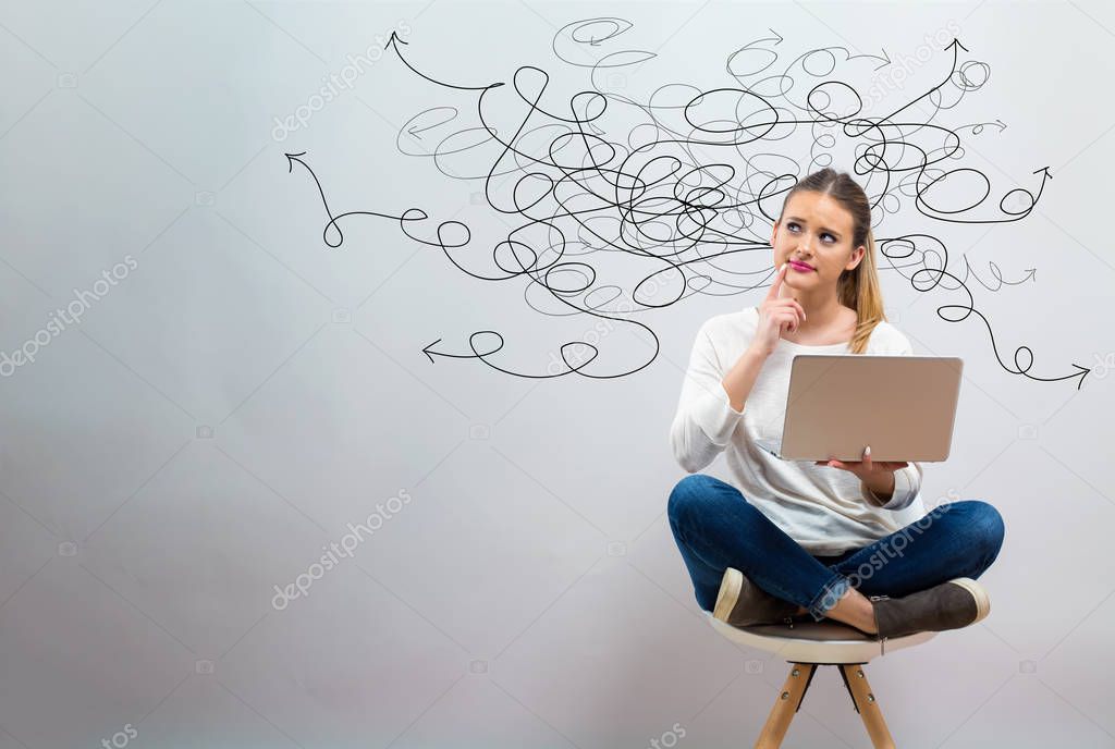 Solving a problem concept with young woman using her laptop 