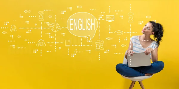 Engels met vrouw met behulp van een laptop — Stockfoto