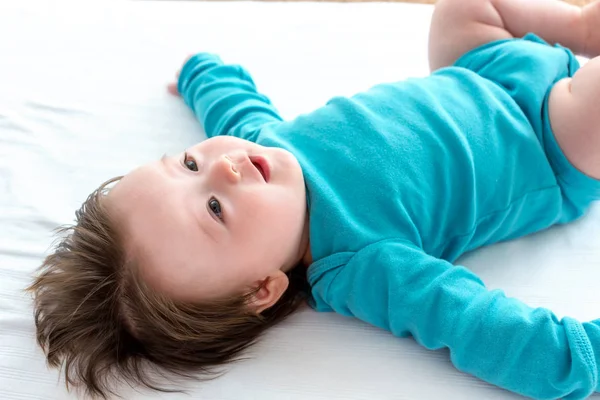 Happy baby boy lying down — Stock Photo, Image