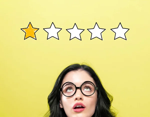 One star rating with young woman — Stock Photo, Image