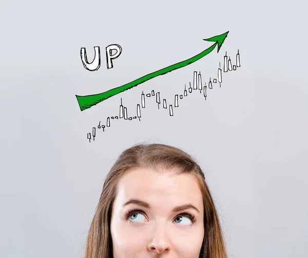 Marknaden trend diagram med ung kvinna — Stockfoto