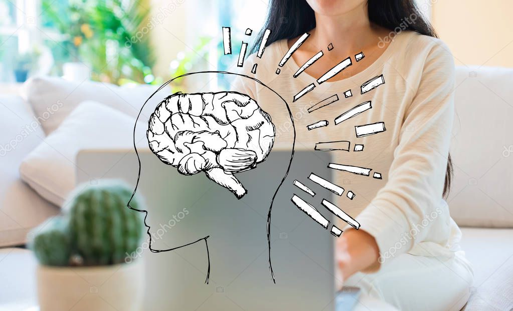 Brain illustration with woman using her laptop