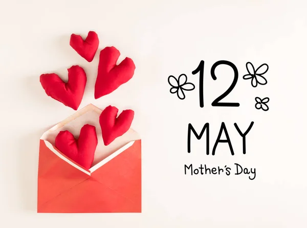 Mothers Day message with red heart cushions — Stock Photo, Image