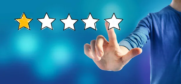 One star rating with a man — Stock Photo, Image