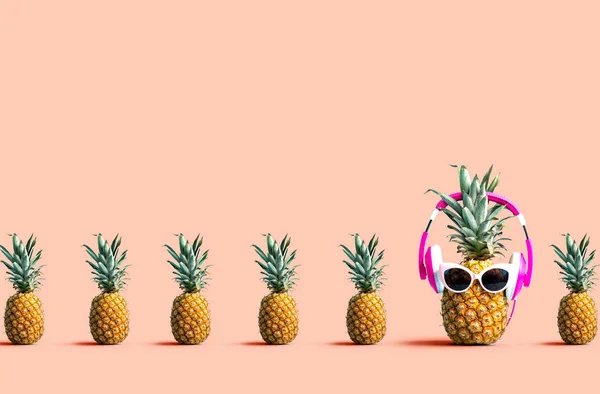 One out unique pineapple wearing headphones — Stock Photo, Image