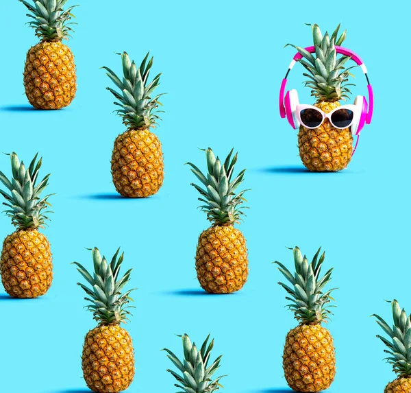 One out unique pineapple wearing headphones — Stock Photo, Image