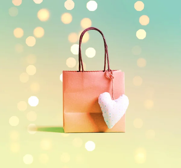Shopping bag on a shiny background — Stock Photo, Image