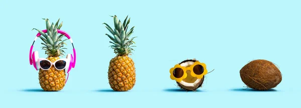 Abacaxi e coco usando óculos de sol — Fotografia de Stock