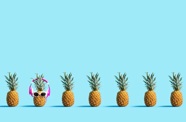 One out unique pineapple wearing headphones — Stock Photo, Image