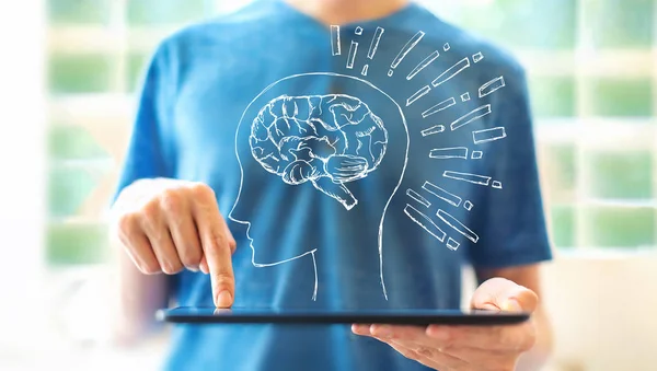 Mozková ilustrace s člověkem pomocí tabletu — Stock fotografie