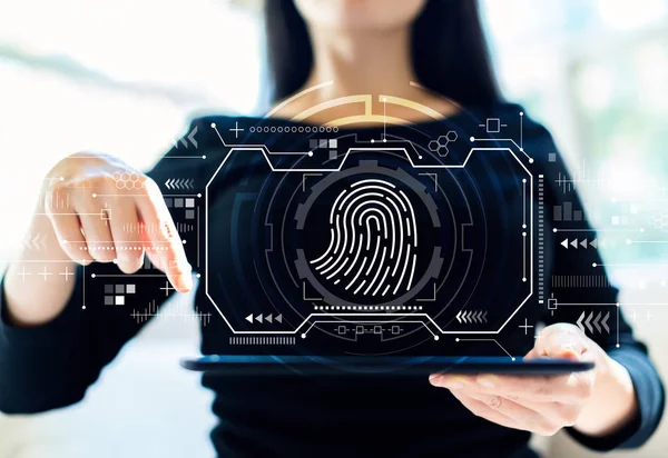 Fingerprint scanning theme with woman using tablet — Stock Photo, Image