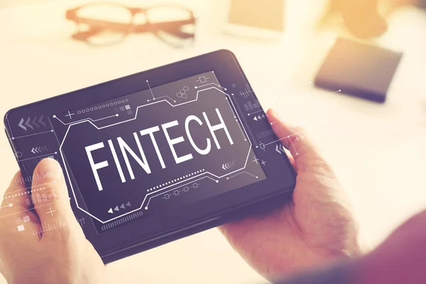 Fintech concept with a tablet computer — Stock Photo, Image