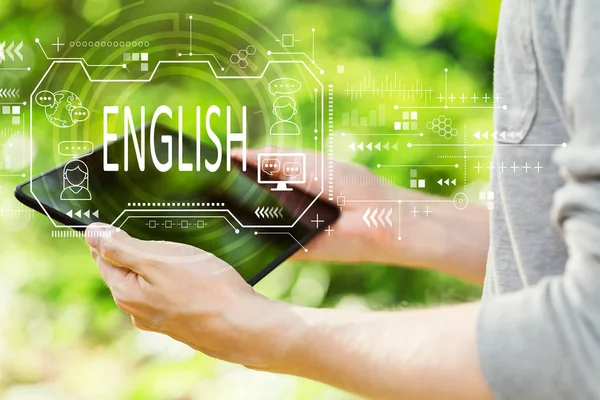 Concepto inglés con el hombre sosteniendo su tableta — Foto de Stock