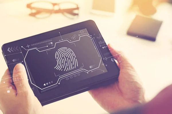 Fingeravtryck scanning tema med en Tablet PC — Stockfoto
