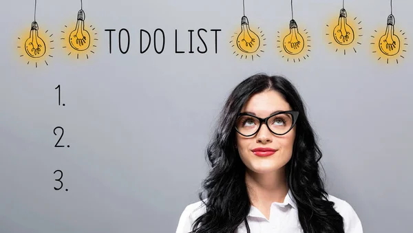 To do list with young businesswoman — Stock Photo, Image