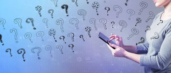 Small question marks with woman using a tablet — Stock Photo, Image