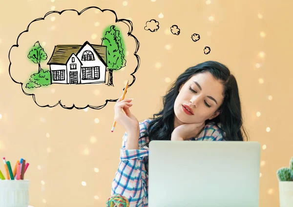 Dreaming of new home with young woman — Stock Photo, Image