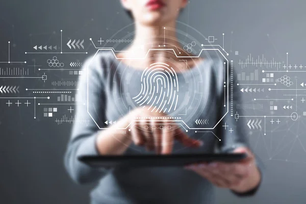 Fingerprint scanning theme with woman using a tablet — Stock Photo, Image