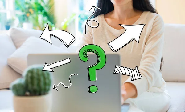 Question mark with arrows with woman using her laptop — Stock Photo, Image